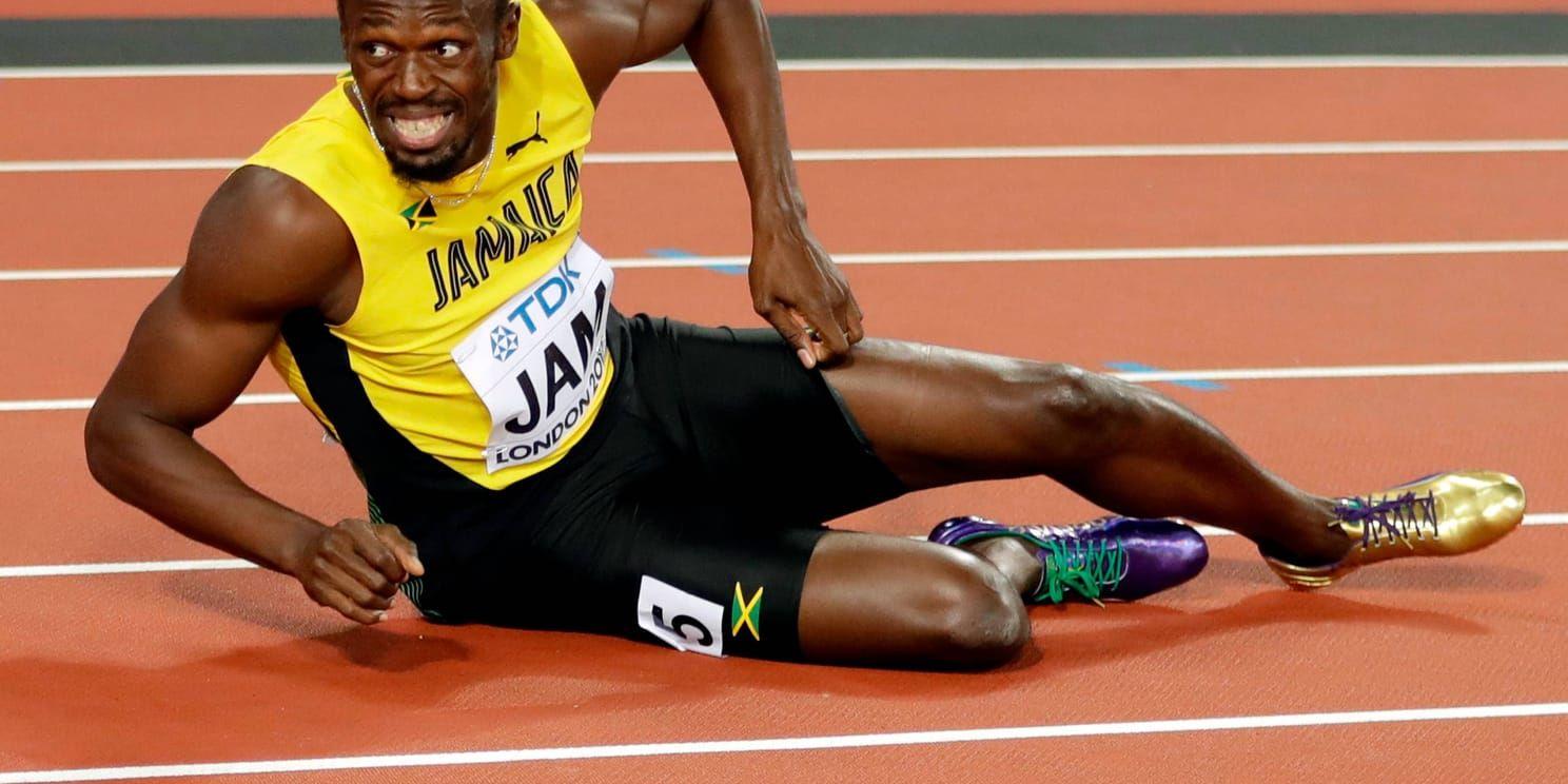 Usain Bolt grinar illa sedan han skadat sig under sitt livs sista mästerskapslopp.