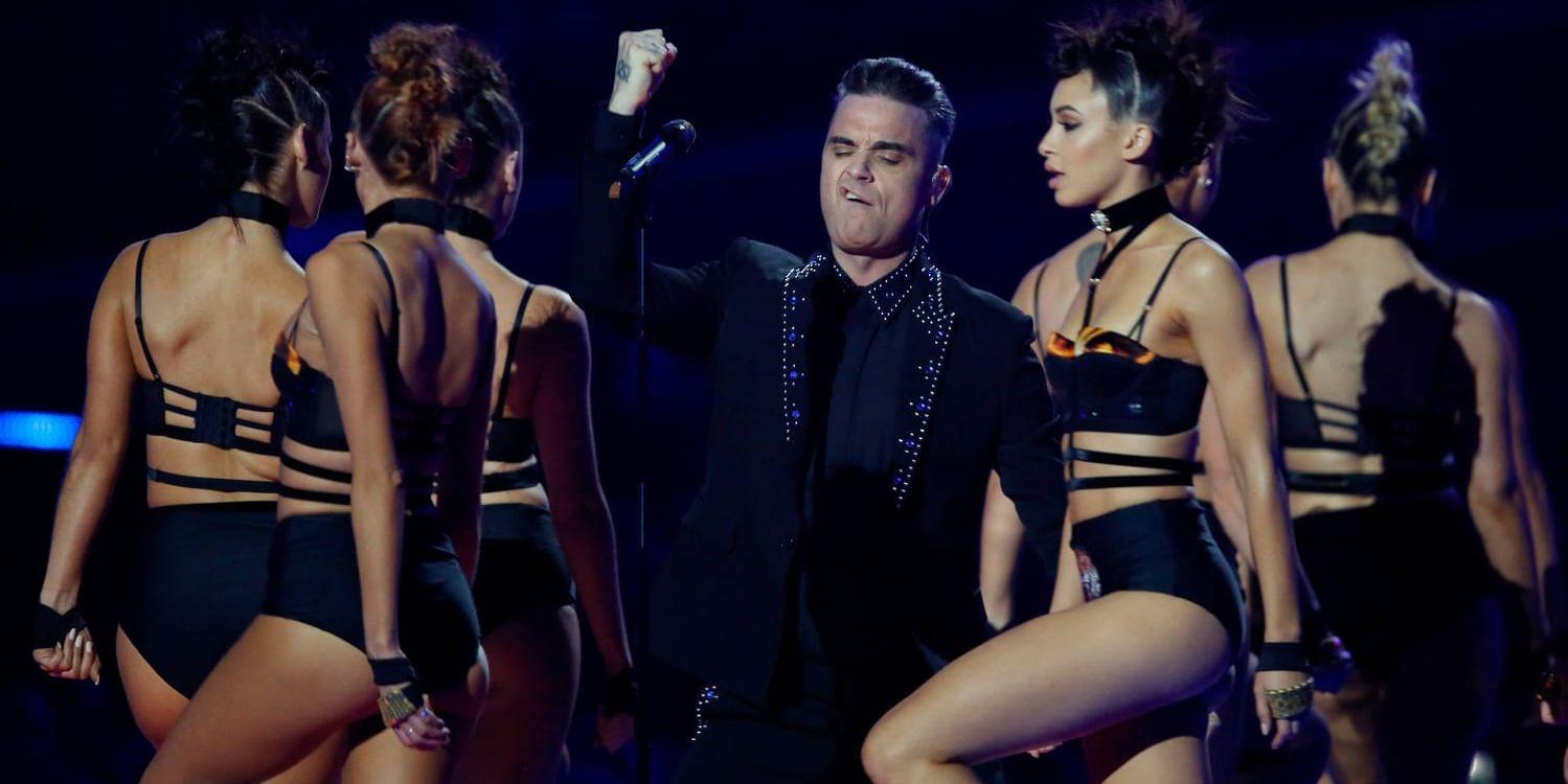 Robbie Williams dras med ryggproblem som innebär att han måste ta smärtstillande injektioner inför sina konserter. Arkivbild.